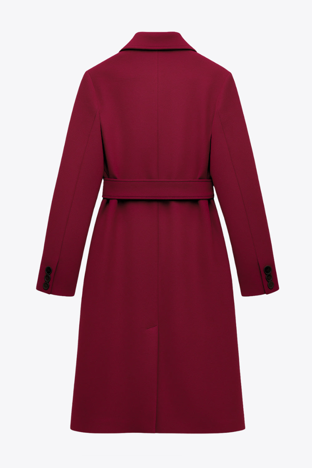 Abrigo largo de fit recto con solapa, manga larga con puños abotonados y bolsillos delanteros con vivos. Cierre frontal con doble cruce de botones. Detalle de abetura posterior en bajo, trabillas y cinturón amarrable del mismo tejido.