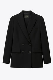 Blazer cruzado de fit oversized, con solapa y hombreras, manga larga y bolsillos delanteros con cartera. Cierre frontal con cruce de botones en contraste.