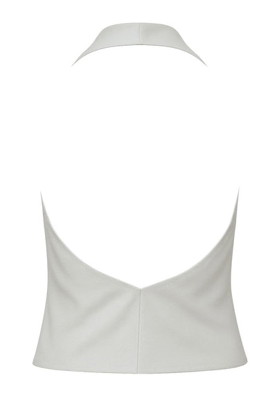 Blusa corta de cuello halter, escote fluido frontal y en espalda.