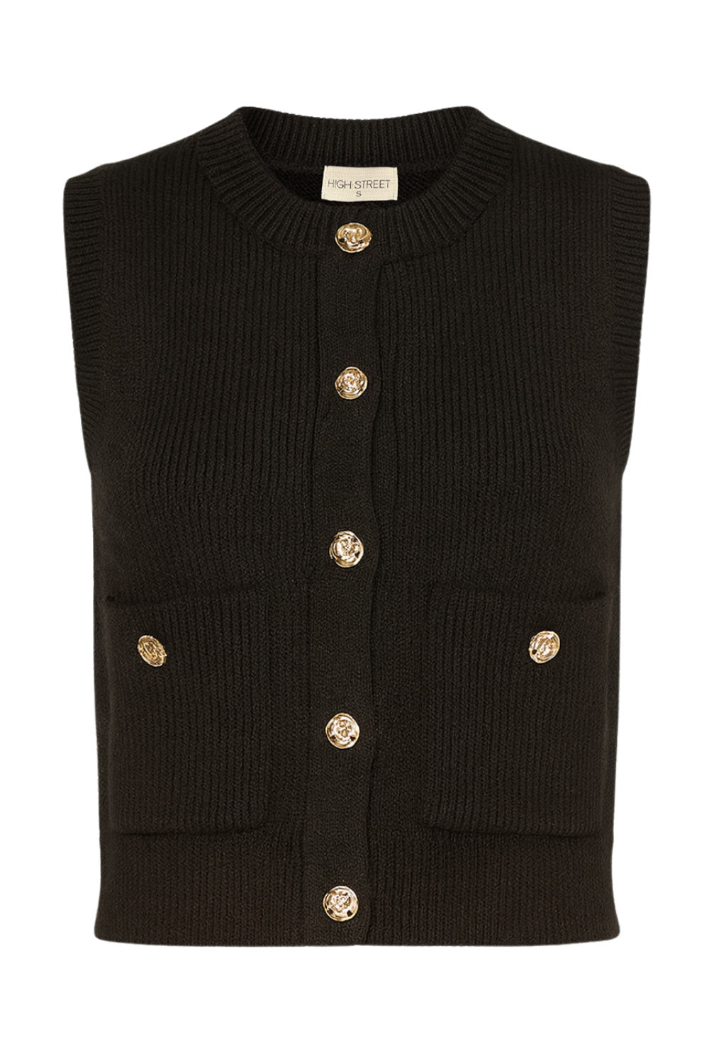 Chaleco corto de punto, fit recto, bolsillos frontales con botón, rib en puños, bajo y cuello redondo. Cierre frontal con hilera de botones en contraste.