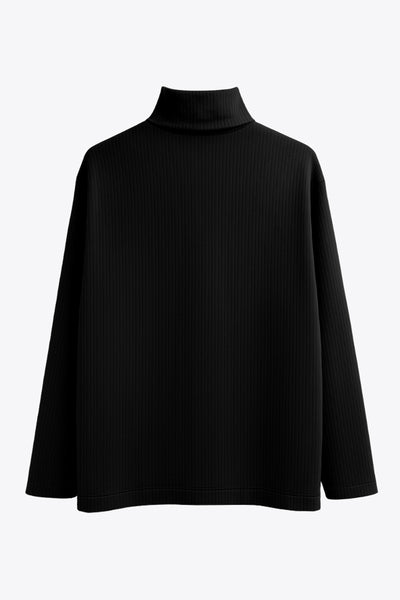 Jersey canalé de punto, fit oversized, cuello alto con doblez y manga larga.