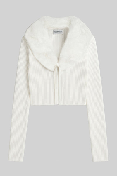 Jersey corto canalé de fit recto, manga larga, cuello v con solapa desmontable de efecto pelo y cierre frontal lazo amarrable.