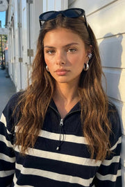 Jersey de punto, estampado rayas, fit recto, manga larga con rib en puños y cuello solapa con cremallera en contraste.