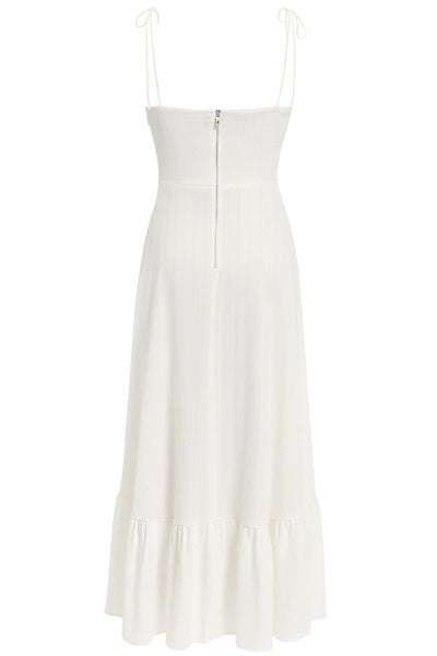 Maxi vestido de corte en a, tirantes delgados con nudo amarrables, escote corazón con cortes y detalles plisados. Cierre posterior con cremallera visible en contraste y olanes en borde de bajo.