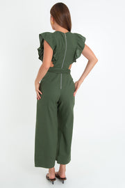 Palazzo de fit culotte, cintura con cut-out en costado, cuello redondo, sin mangas, detalle de olanes en hombros, lazo posterior amarrable en cintura y cierre posterior con cremallera visible en contraste.