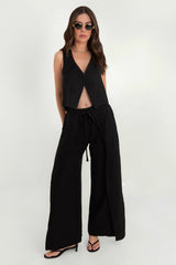Pantalón cruzado wide leg con aberturas lazo cintura