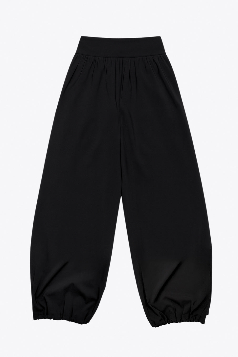 Pantalón de fit harem, cintura alta, peto con corte v frontal y plisado decorativos, rib elástico en bajo y cierre lateral con cremallera oculta.