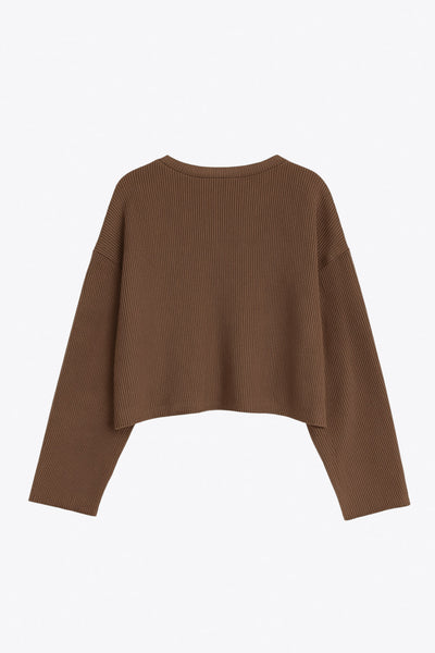 Jersey básico de punto, fit recto, cuello redondo y manga larga de hombro caído.