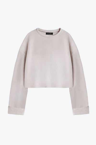 Jersey básico de punto, fit recto, cuello redondo, manga larga de hombro caído y rib en puños.