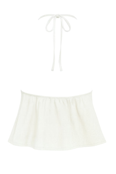 Top corto canalé de cuello halter, escote v con lazo amarrable frontal, rib elástico en espalda, tirantes con lazo amarrable posterior y abertura frontal en bajo. Detalle de peplum olanes.