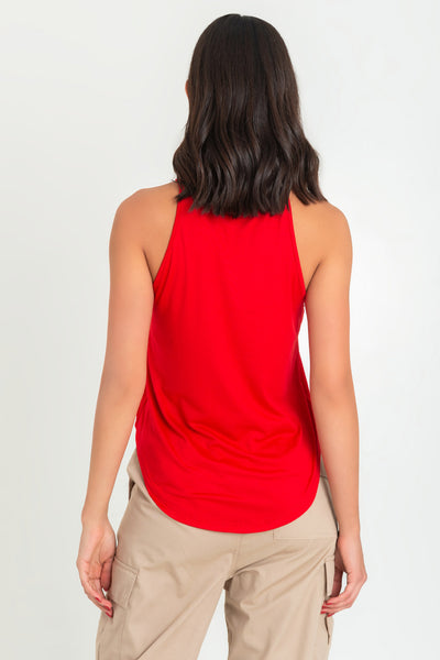 Top de cuello halter sin mangas, tirantes finos, bajo curveado y silueta ligeramente oversize.