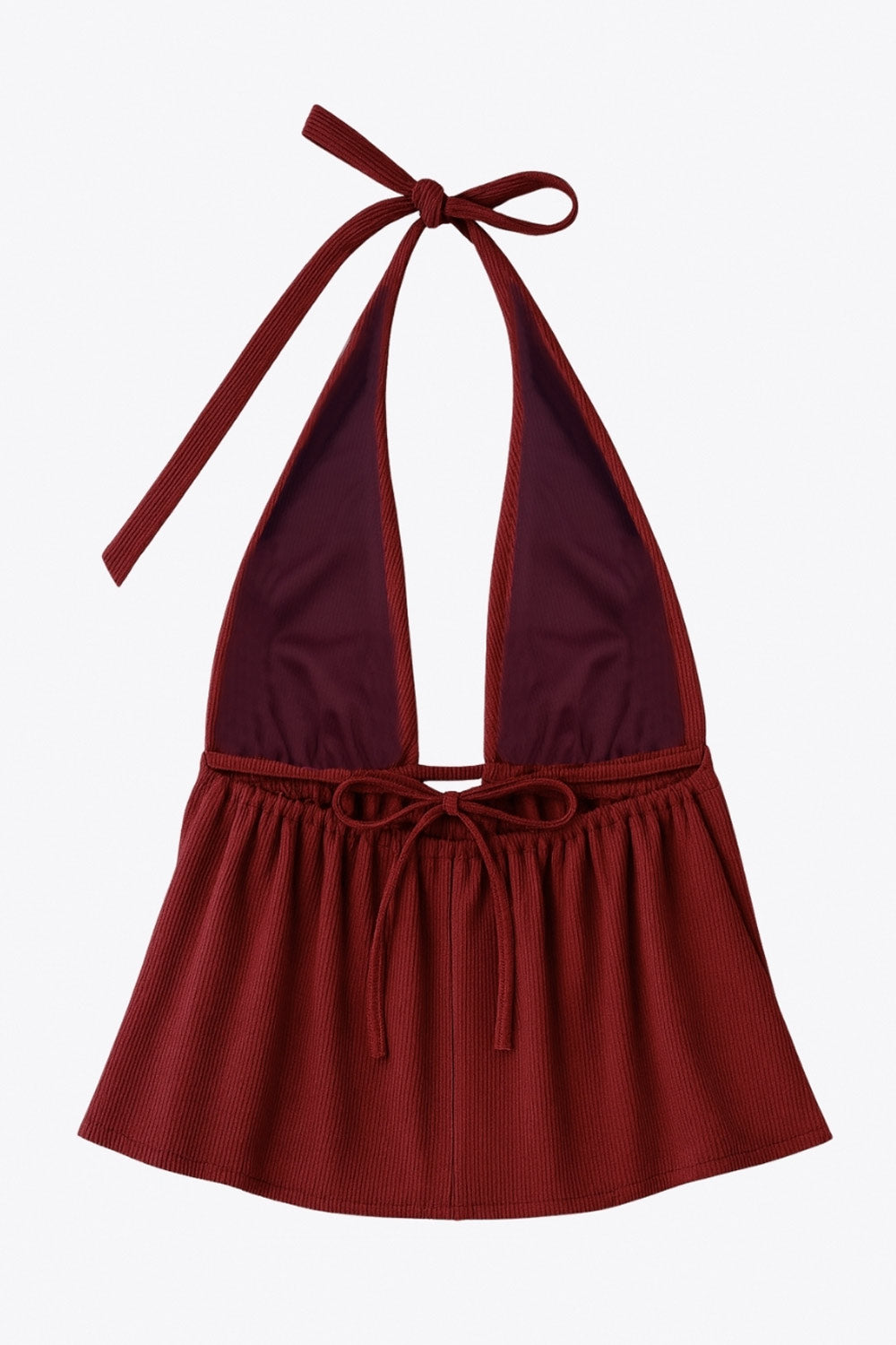 Top canalé de cuello halter con nudo amarrable posterior, escote v con plisados frontales, rib elástico en cintura y peplum olanes. Detalle de escote en espalda con lazo amarrable posterior.