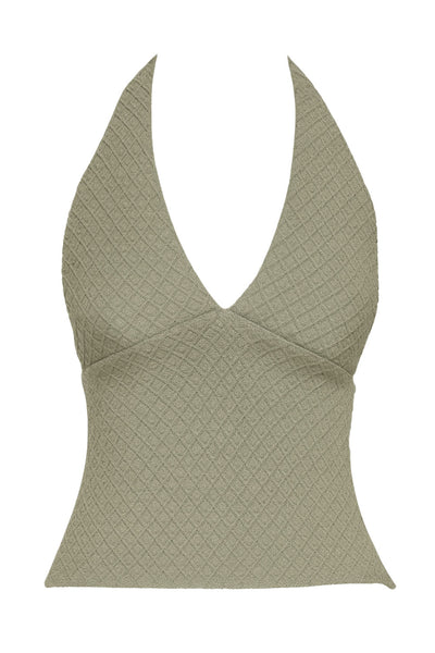 Top corto de cuello halter con escote v y cortes frontales, fit ajustado, escote en espalda y detalle de textura en tejido.