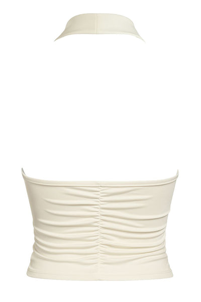 Top halter de fit ajustado, cuello alto fluido, sin mangas, plisados en costados y espalda.