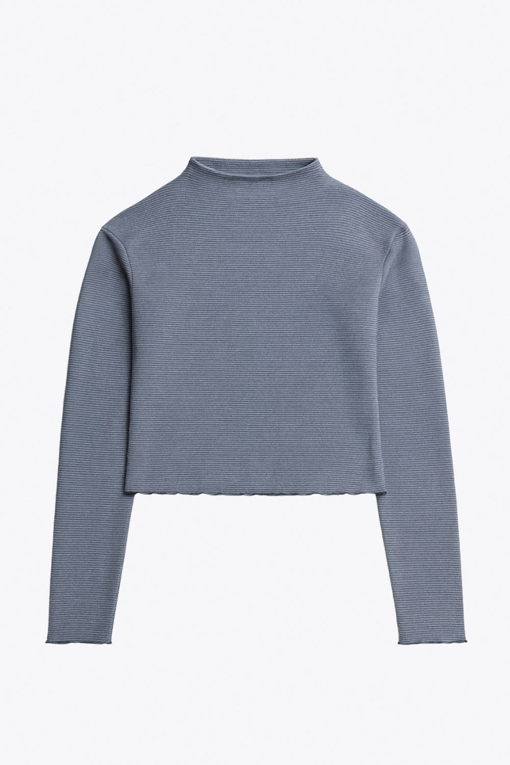Top de manga larga con hombro caído, cuello mock seguido, fit recto, textura en tejido, detalle de rib en borde de bajo y puños.