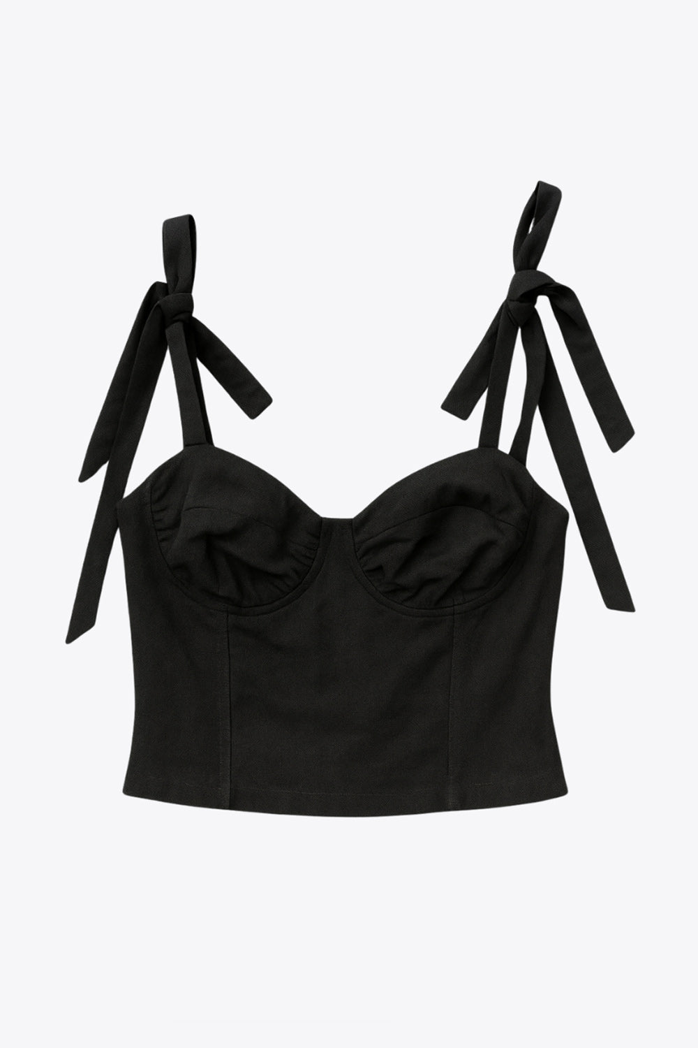 Crop top de fit ajustado, escote corazón con cortes decorativos, costuras frontales, tirantes con nudo amarrable y cierre posterior con cremallera visible en contraste.