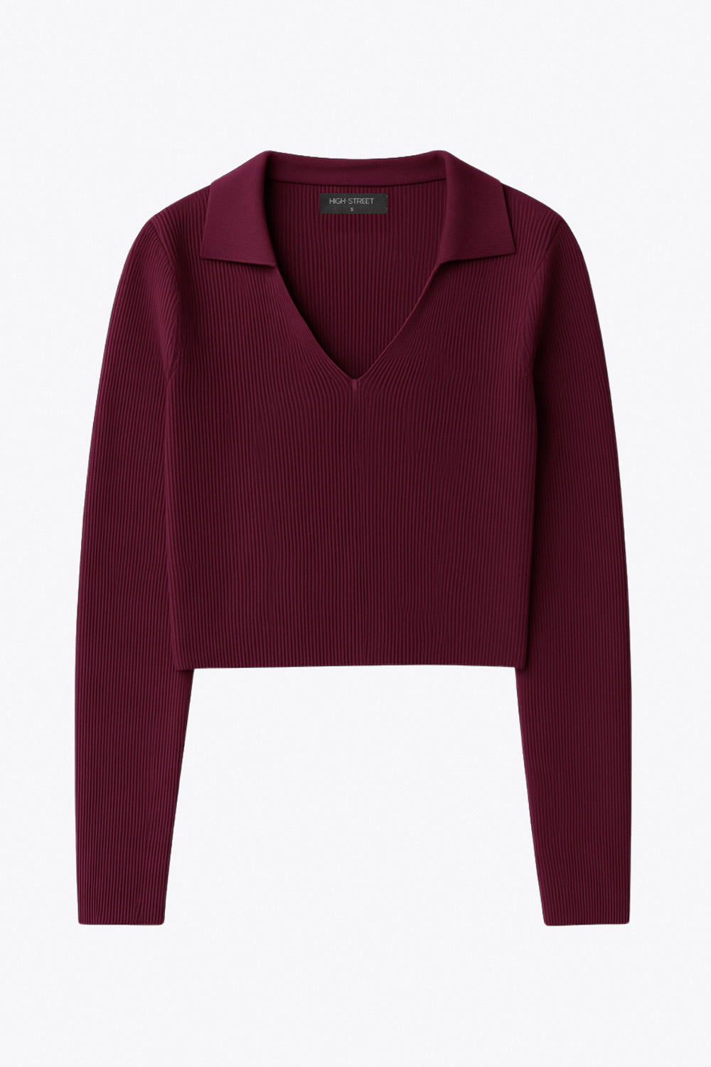 Top canalé de punto, fit ajustado, manga corta y escote v con cuello polo.