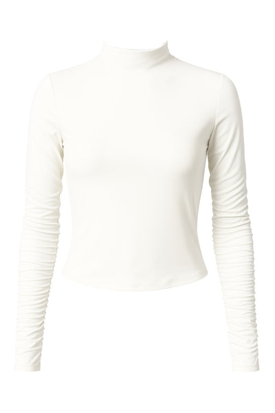 Top básico de fit recto, cuello mock seguido y manga larga.