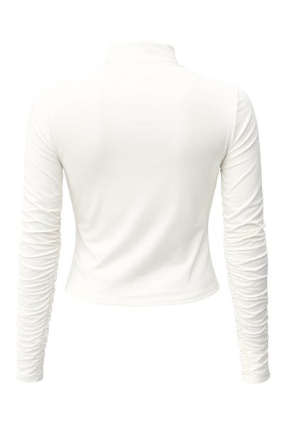 Top básico de fit recto, cuello mock seguido y manga larga.