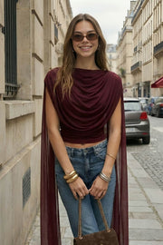 Top de mesh, fit ajustado, sin mangas, cuello barco y detalle decorativo frontal con plisados en hombros y costados.
