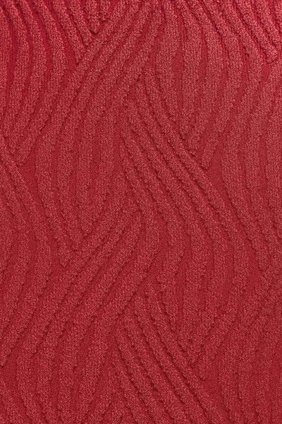 Vestido corto de fit recto, sin mangas, cuello barco y escote en espalda con lazo amarrable posterior. Detalle de textura en tejido.