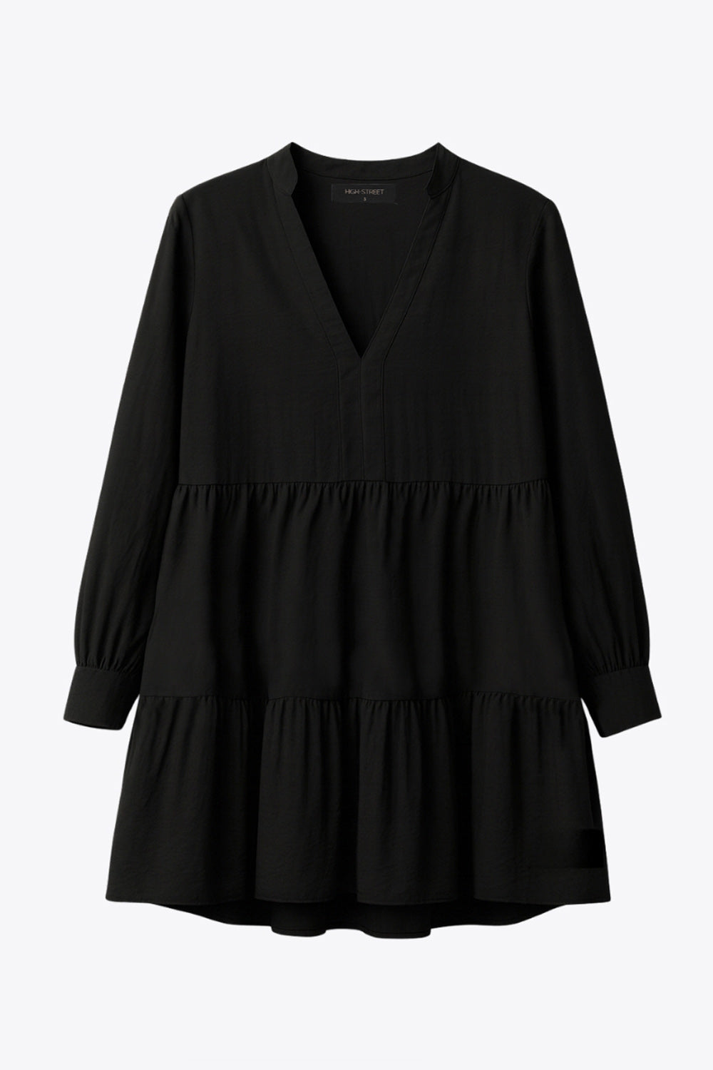 Vestido corto camisero de manga larga abullonada con puño abotonado, corte en a, escote v con costuras, cuello mao y capas con olanes en bajo.