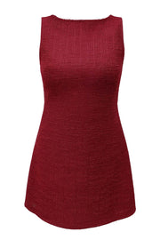 Vestido corto de fit recto, sin mangas, cuello barco y escote en espalda con lazo amarrable posterior.