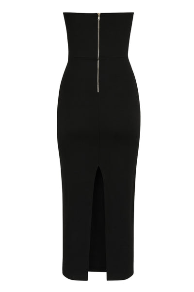 Vestido midi de fit ajustado, strapless, escote recto y detalle de cut outs frontales. Cierre posterior con cremallera visible en contraste y abertura en bajo.